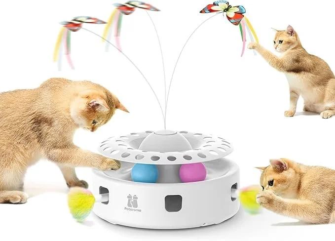 Cats playing with an interactive butterfly and feather toy